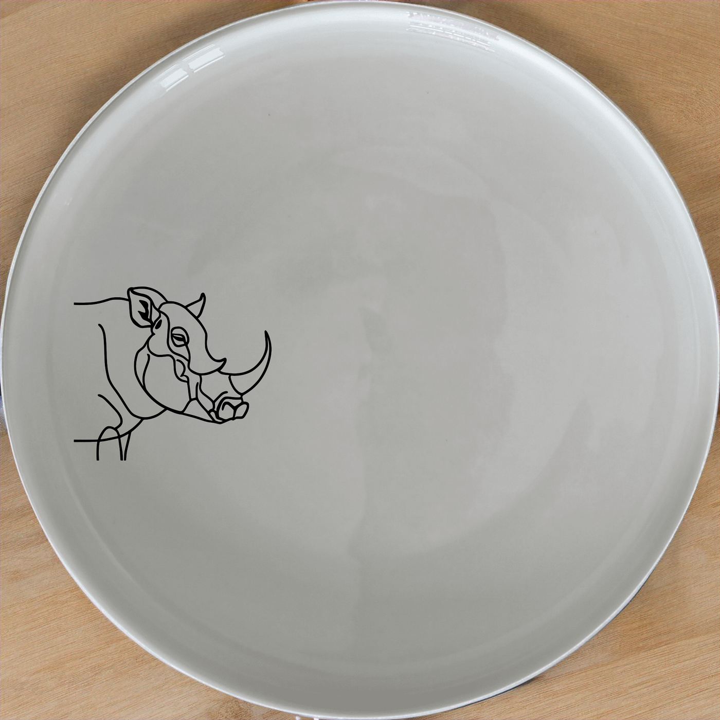 Warthog Tusks Side Plate Set of 4 - Range 1 adds a unique touch to your dining table with its elegant design and durable ceramic construction.