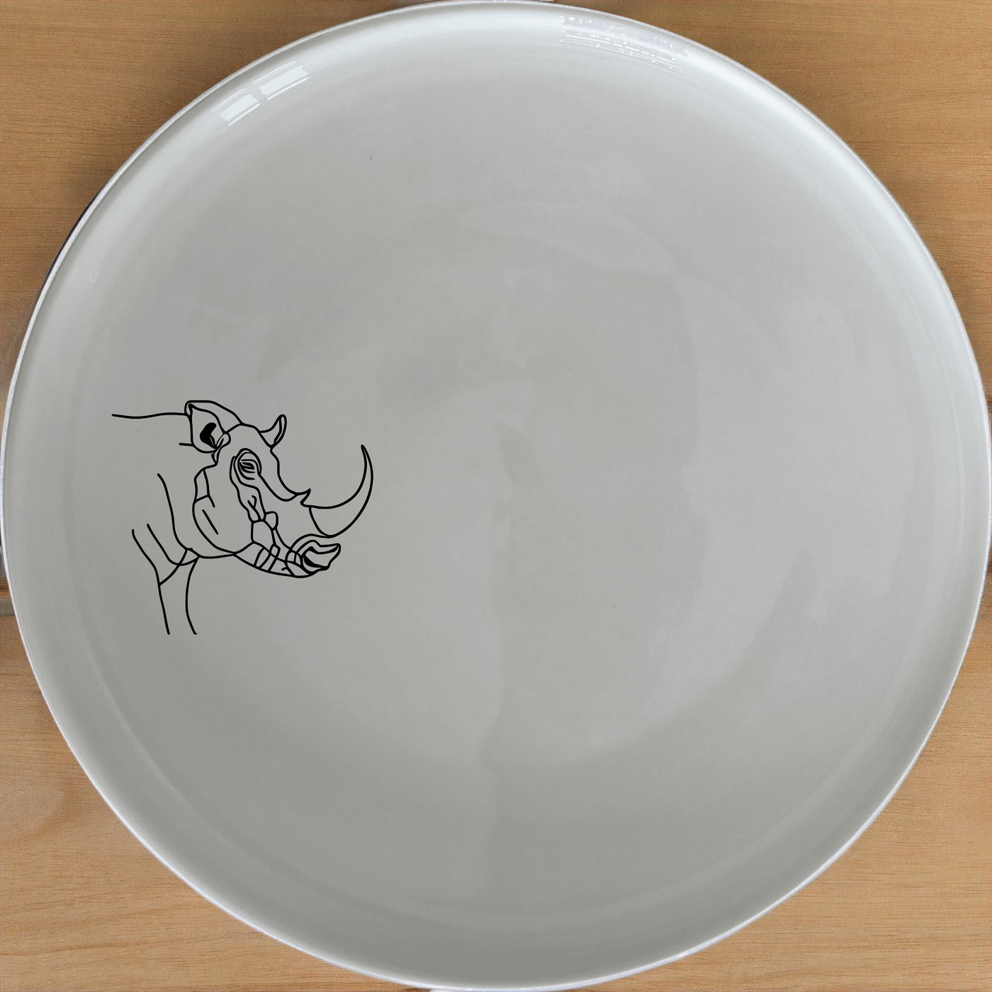 Warthog Tusk Side Plate Set of 4 - Range 2 adds a unique touch to your dining table with its artistic design and durable ceramic construction.