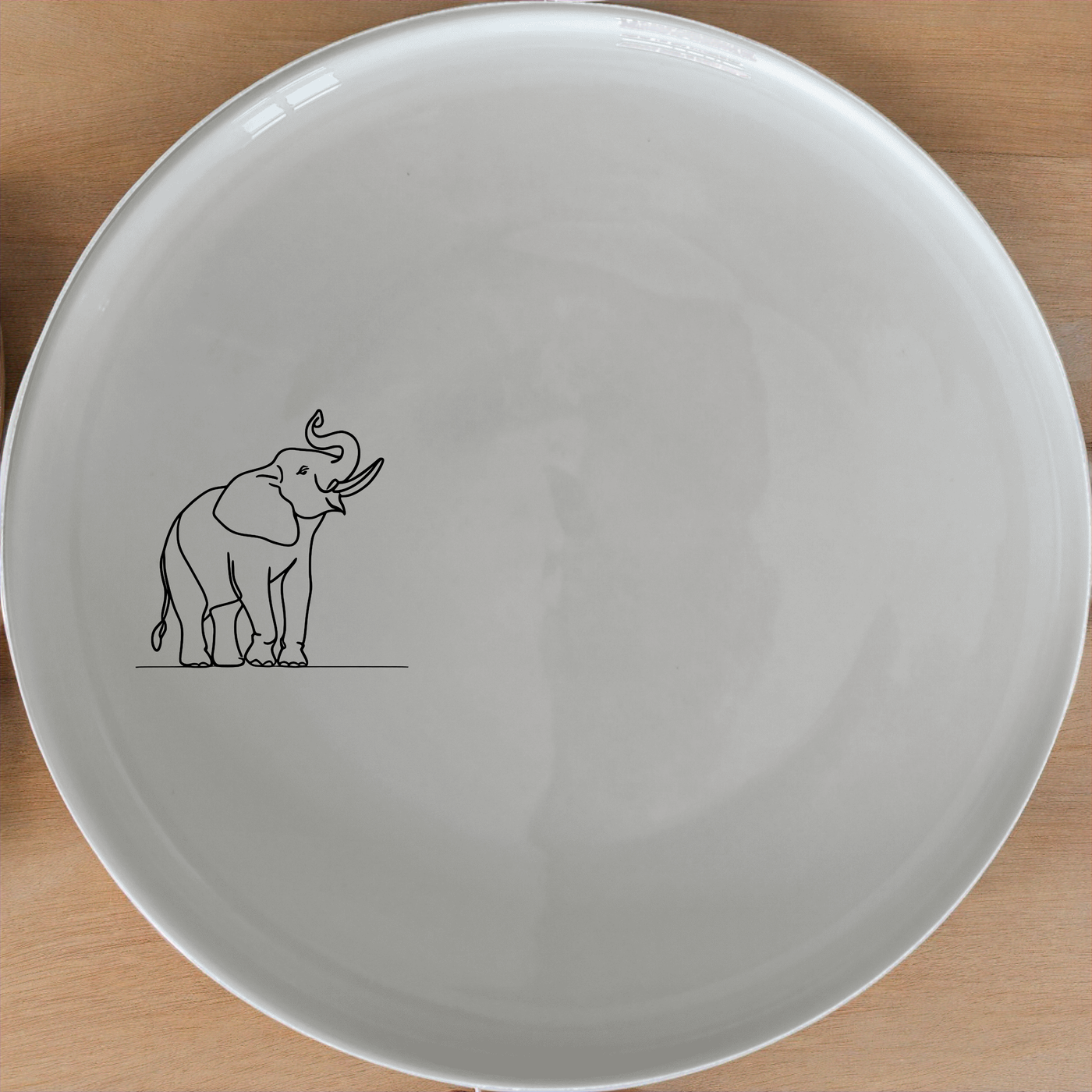 Wise Elephant Matriarch Side Plate Set of 4 - Range 4 adds a touch of elegance to any dining table with its unique design.