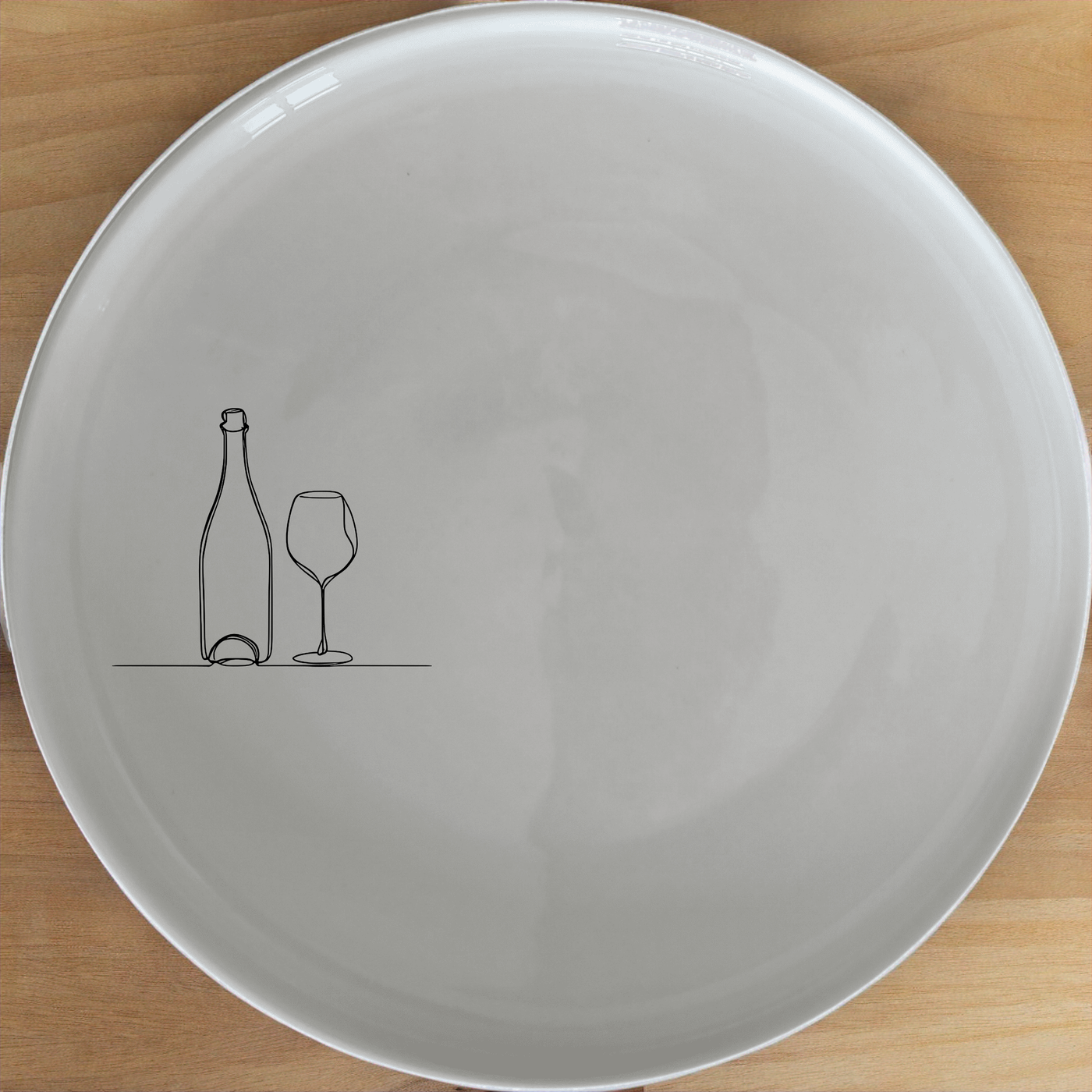 The Bottle Wine Glass Dinner Plate Set of 4 - Range 3 is a stylish and versatile dinnerware set perfect for any dining occasion. Crafted from high-quality ceramic, these plates feature a minimalist design with a subtle illustration of a bottle and glass, adding a touch of sophistication to your table setting. Ideal for both everyday use and special events, this set offers durability and elegance in one package.