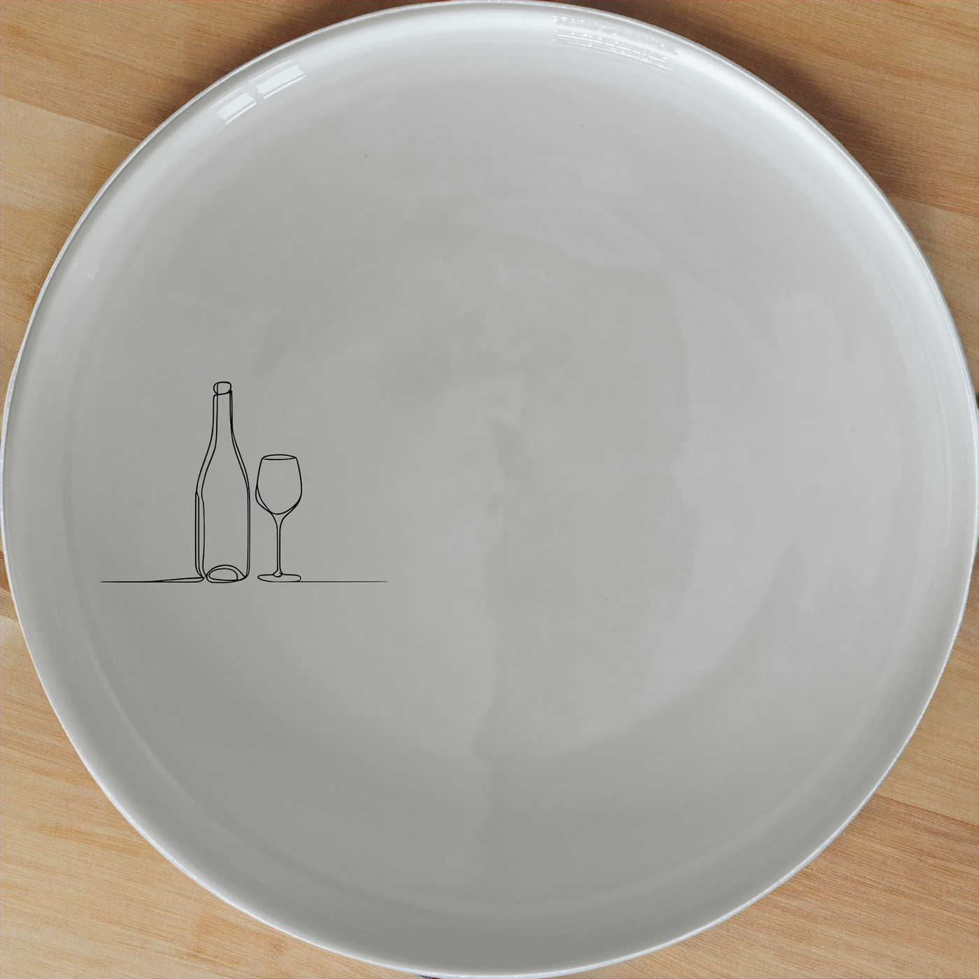 Bottle Wine Glass Side Plate Set of 4 - Range 2 is a stylish and modern dinnerware set perfect for any home. Crafted from premium ceramic, these plates feature a minimalist design with a subtle wine bottle and glass illustration. Ideal for everyday use or special occasions, this set adds a touch of elegance to your dining table.
