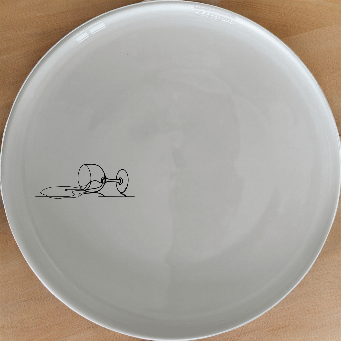 Spilled Glass Wine Dinner Plate Set of 4 - Range 1 is a stylish and modern dinner plate set featuring a unique design of a spilled wine glass.