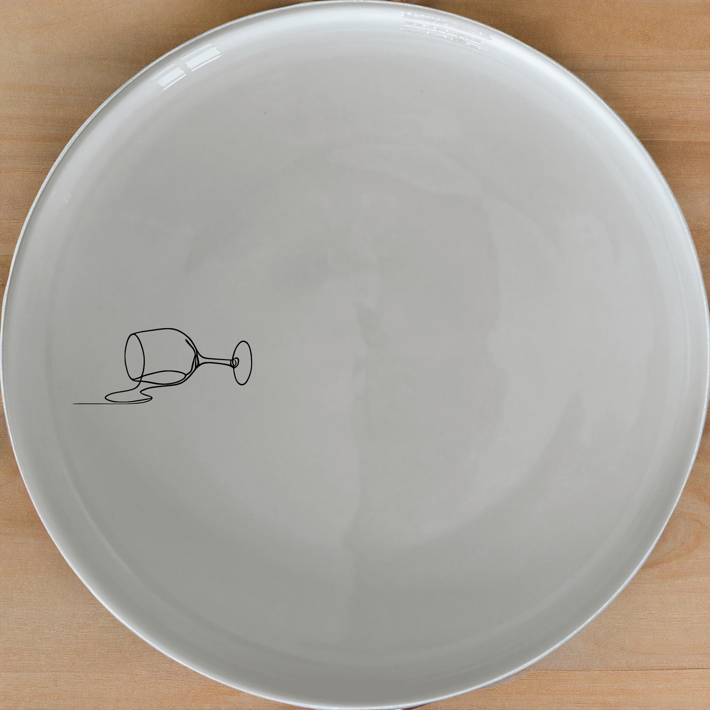 Spilled Glass Wine Dinner Plate Set of 4 - Range 2 adds a modern touch to your dining table with its sleek design and subtle wine glass motif.