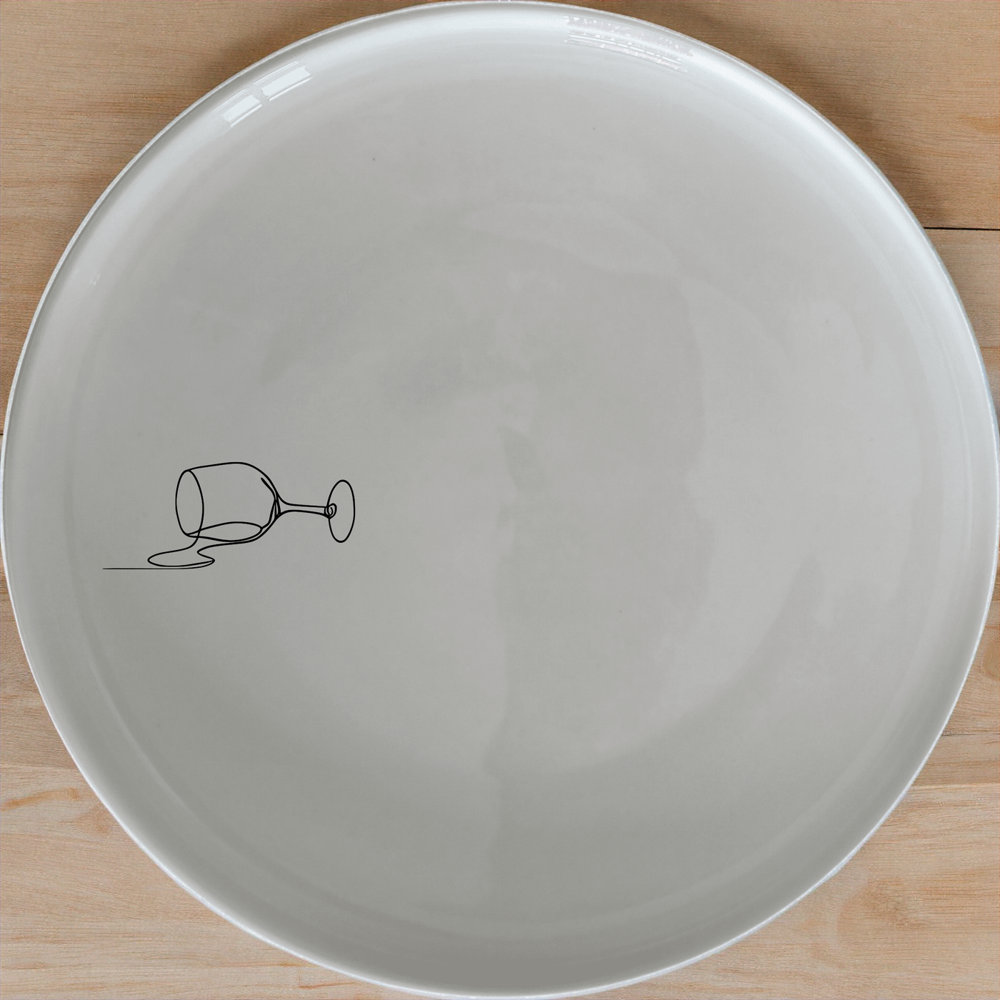 Spilled Glass Wine Side Plate Set of 4 - Range 2 adds a modern touch to your dining table with its minimalist design and elegant wine glass illustration.
