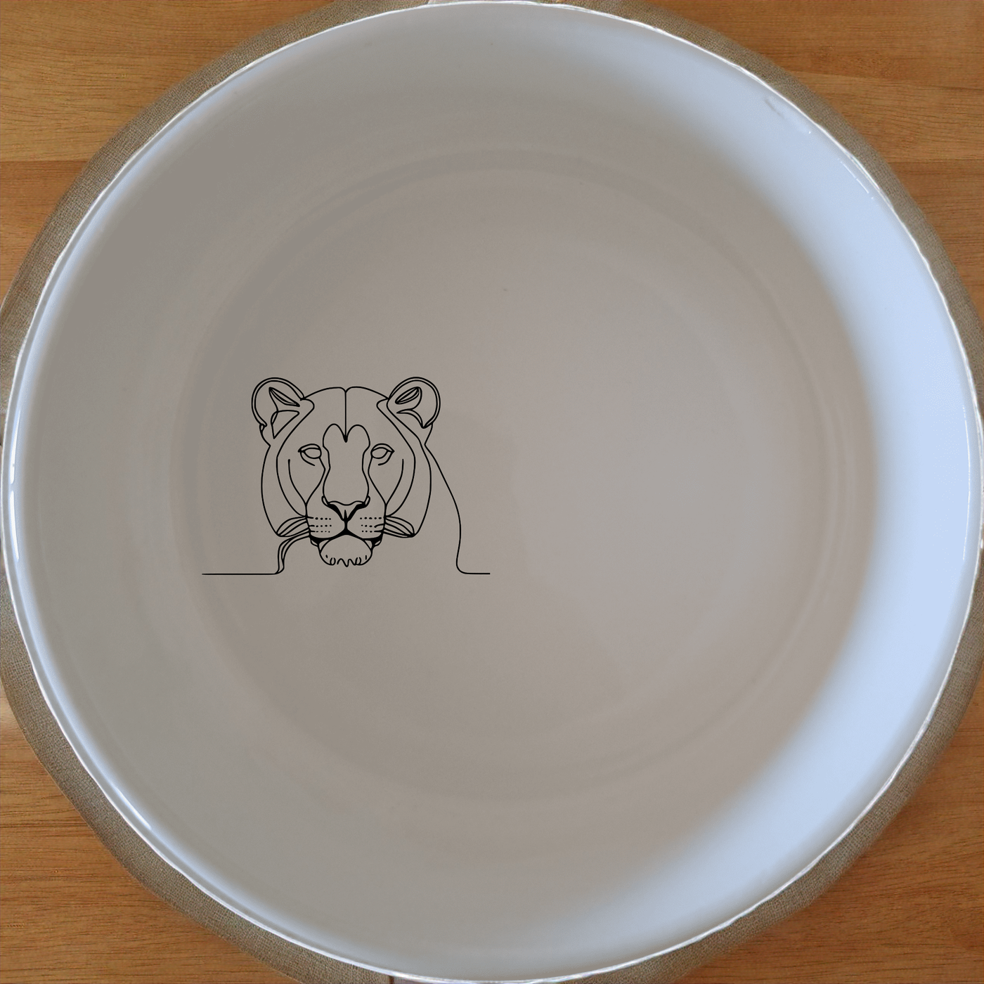 Staring Female Lioness Bowl Set of 4 - Range 1 is a stylish and modern addition to your kitchen. This set of four bowls features a minimalist design with a striking lioness silhouette. Perfect for everyday use or special occasions, these bowls are both functional and decorative.