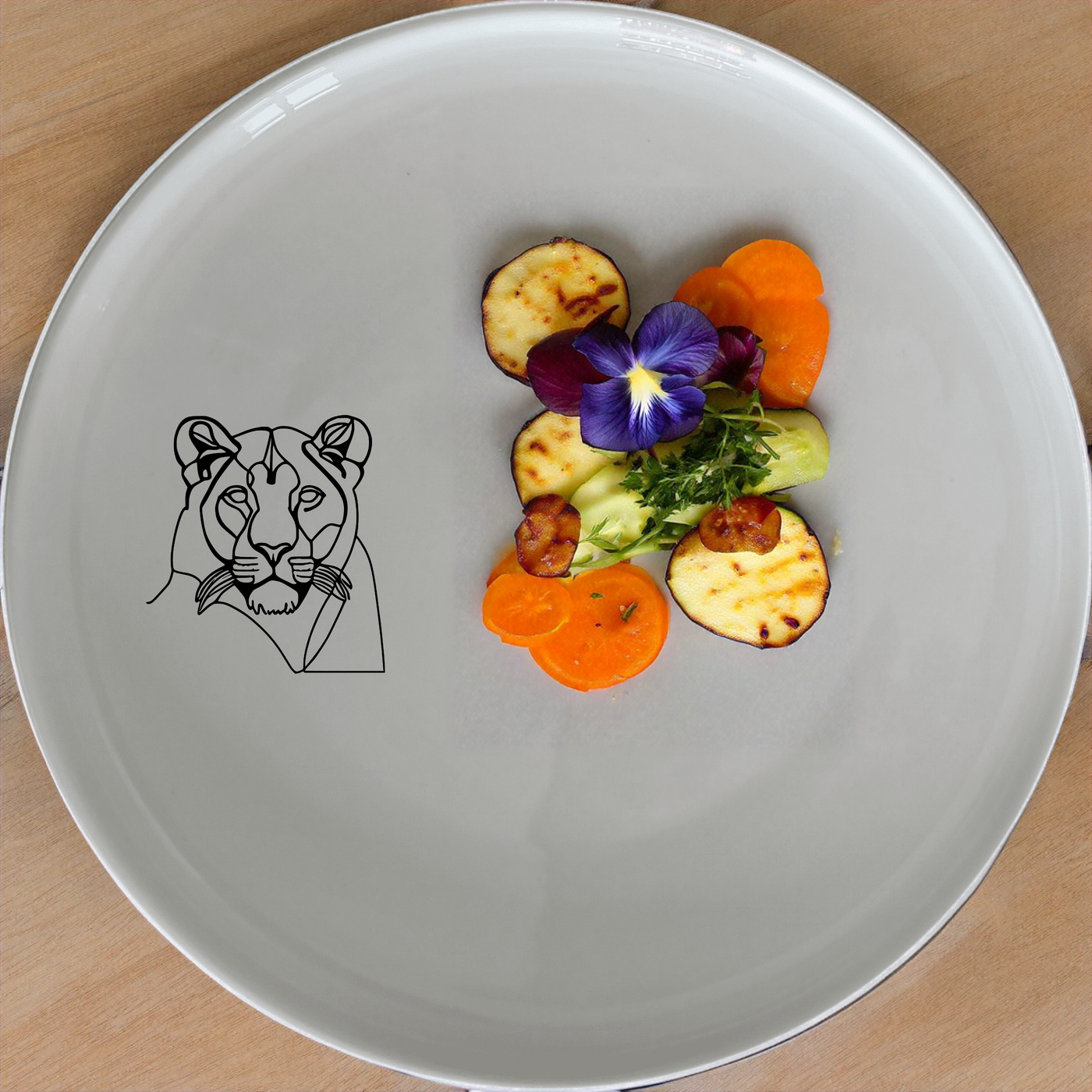 Staring Female Lioness Dinner Set of 12 - Range 4 is a unique and stylish dinnerware set featuring a striking lioness design, perfect for elevating any dining experience.