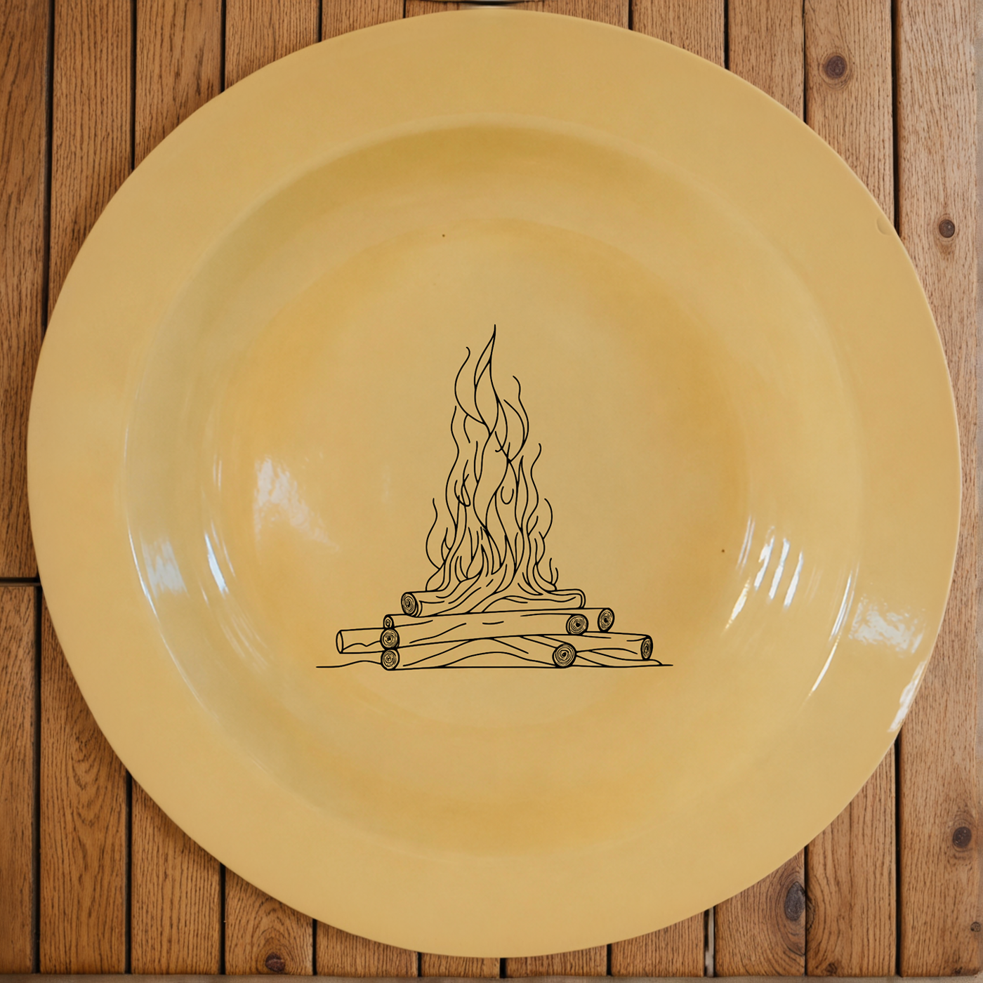 The Wood Fire Dinner Plate Set of 4 brings rustic campfire charm to warm cream enamel dinnerware.