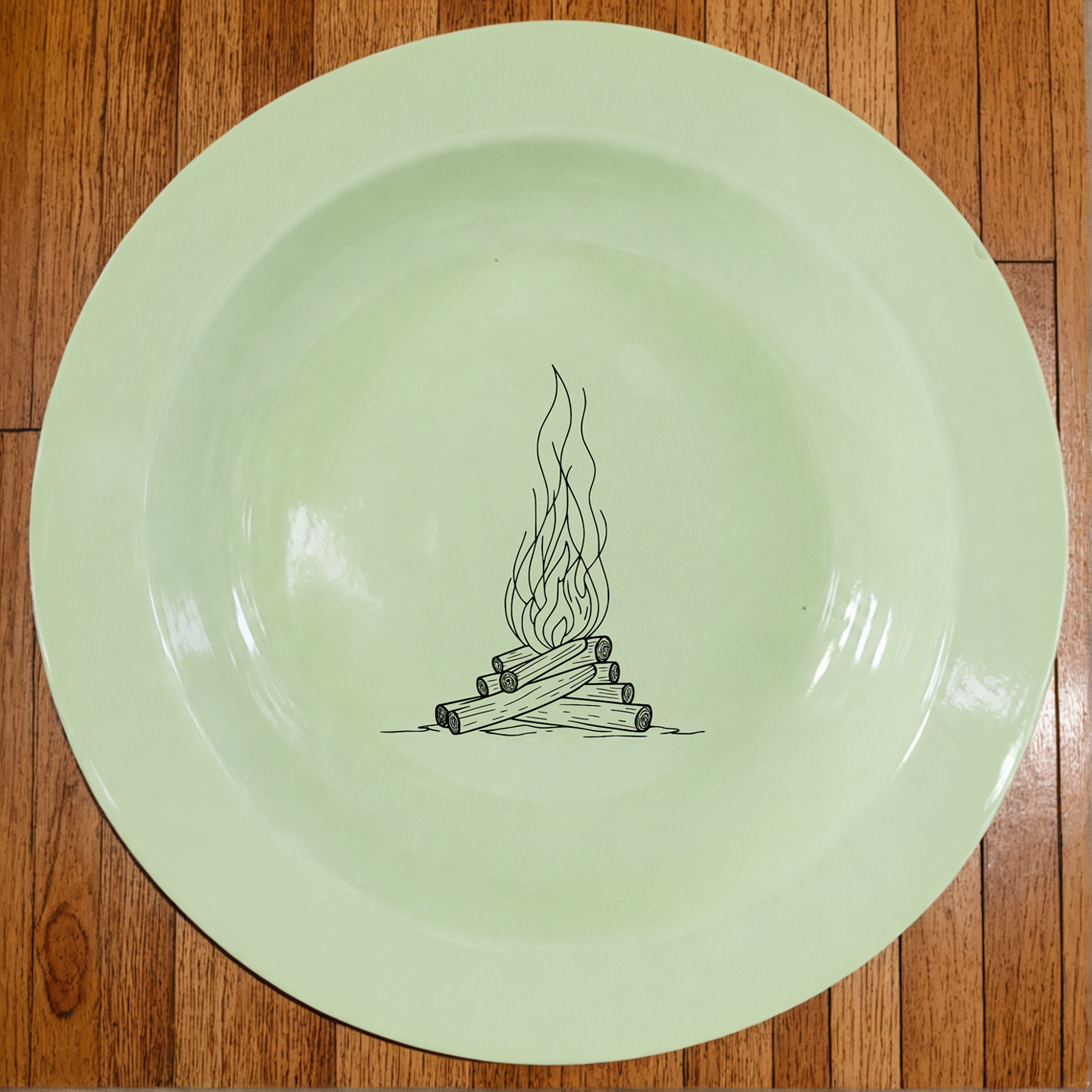 Stacked Wood Dinner Plate Set of 4 brings rustic campfire charm to your table in soft rice green enamel.